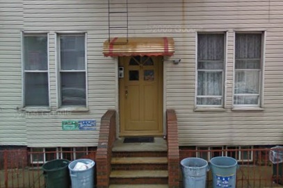 A home on Guernsey Street. Aluminum awnings and vinyl siding are out of style with new owners.