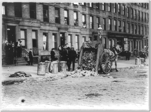 Thats a horse-drawn carriage dumping garbage on the streets right there. Not pictured: all the children and rats who would soon come to play in it.