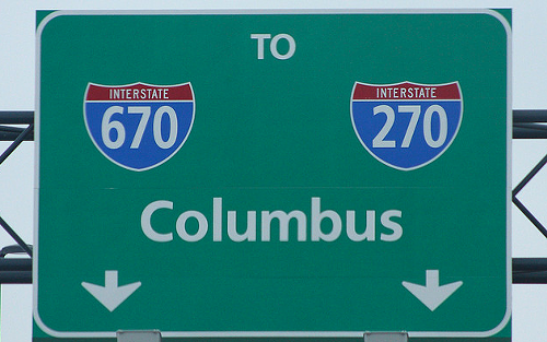 The highway signs in Columbus double as population info.