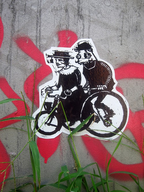 Greenpoint street art: cycling.