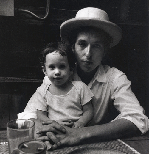 Here is a father and son. In this case, the father is Bob Dylan and the son is his boy Jesse.
