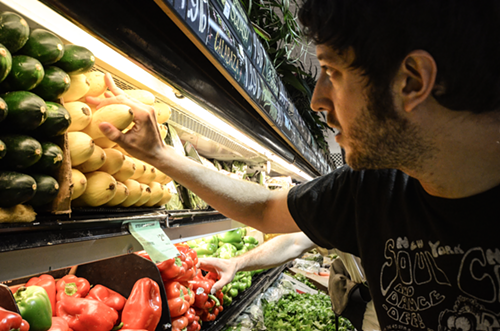 Juan inspects various squash bits for the best squash bits.