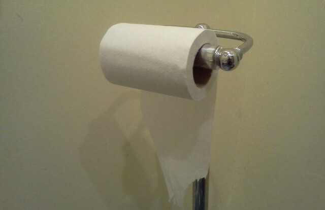 toilet paper hung in an underhand fashion