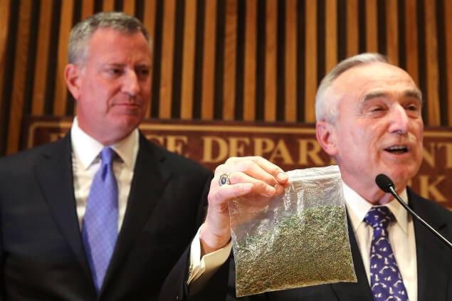 Commissioner Bratton demonstrating, with oregano, what 25 grams looks like. Photo by Spencer Platt/Getty Images