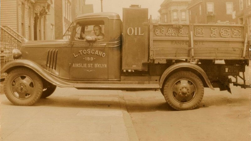 Michael Toscano, father of Brooklyn Public Library patron Vera Toscano, in his company truck, around 1940. Via Culture in Transit