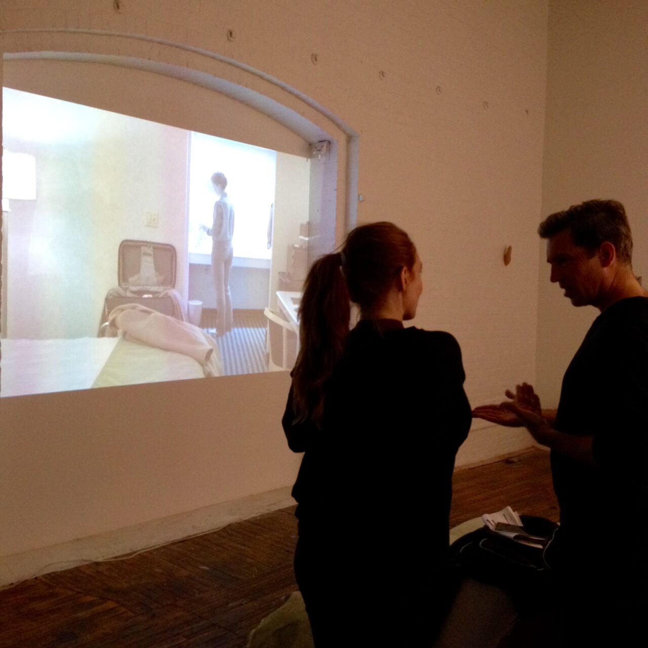 ISCP artist Sara Eliassen discussing her video work with David Helbich, an artist in residence at Residency Unlimited. Photo by Paul D'Agostino.