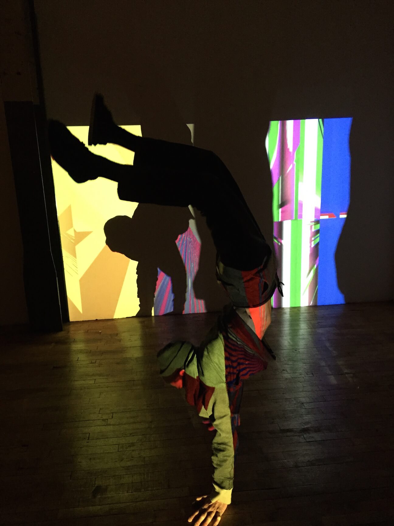 Some jerk doing a handstand in the midst of a projection by Richard Garet, at Studio 10. Image courtesy Larry Greenberg.