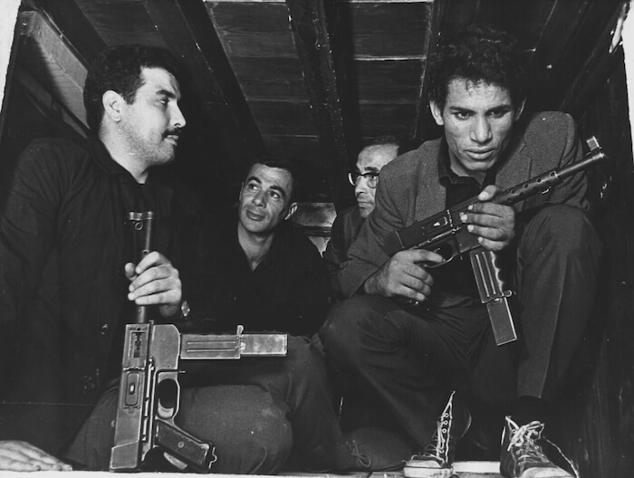 Saadi Yacef (second from left) and Brahim Haggiag (right) in Gillo Pontecorvo's THE BATTLE OF ALGIERS (1966). Courtesy Film Forum. Playing Friday, October 7 - Thursday, October 13.