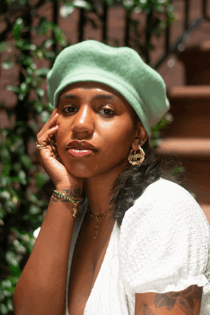 Yaya Bey on a stoop in Downtown Brooklyn