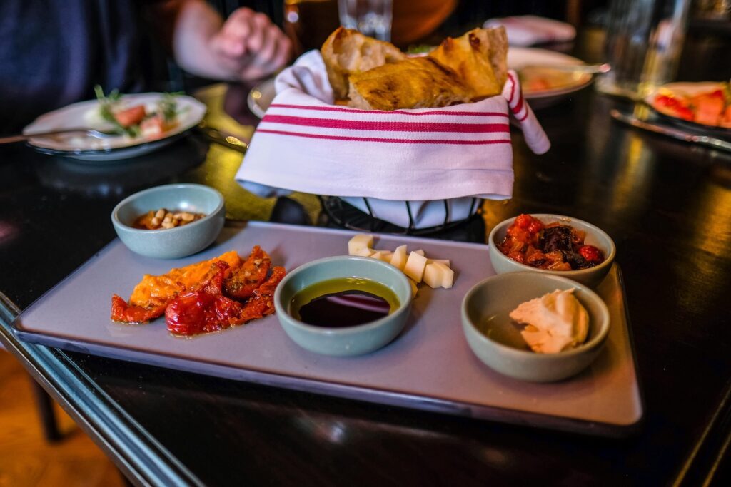 Bread service, complete with spreads and dips, $23 
