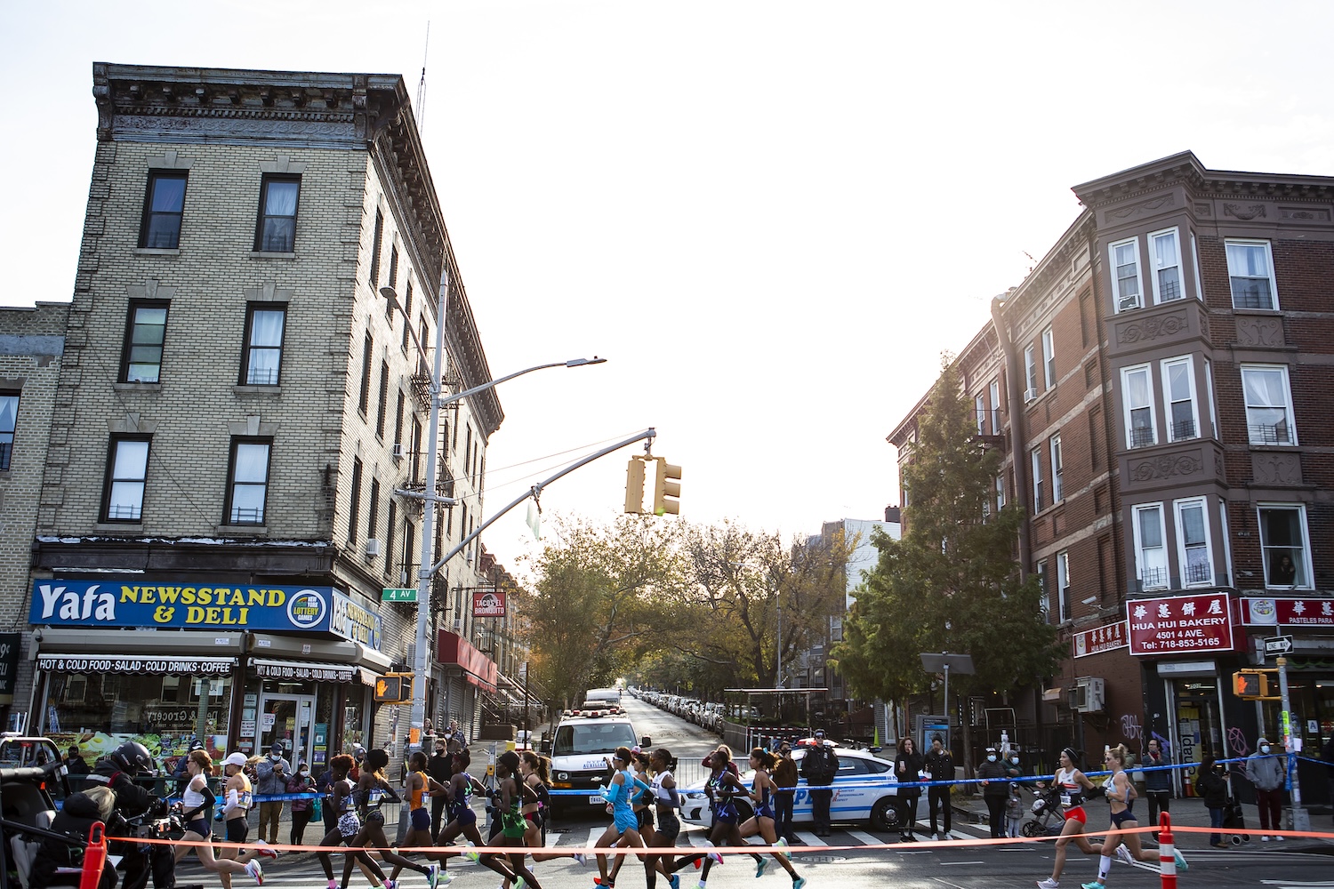 The lead pack of the women's race runs through Brooklyn during the 2021 TCS New York City Marathon