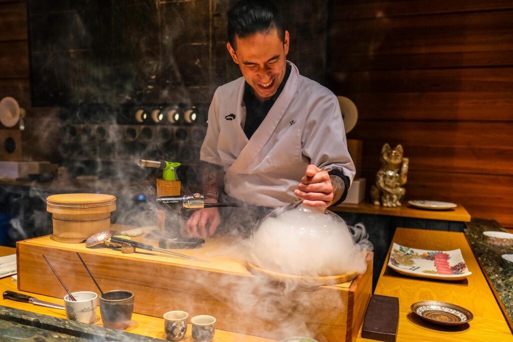 Chef Garrison smoking the king salmon at Sushi Koju in The Ace Hotel in Downtown Brooklyn