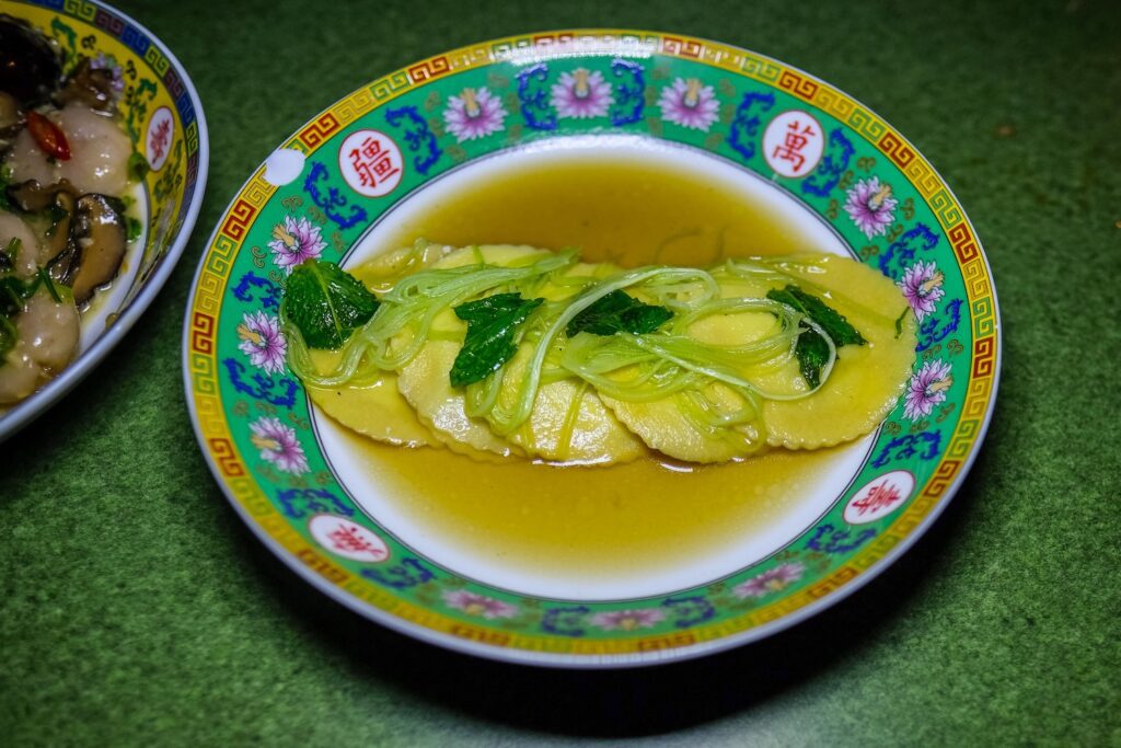 Lime leaf ricotta ravioli in brodo at Kelang