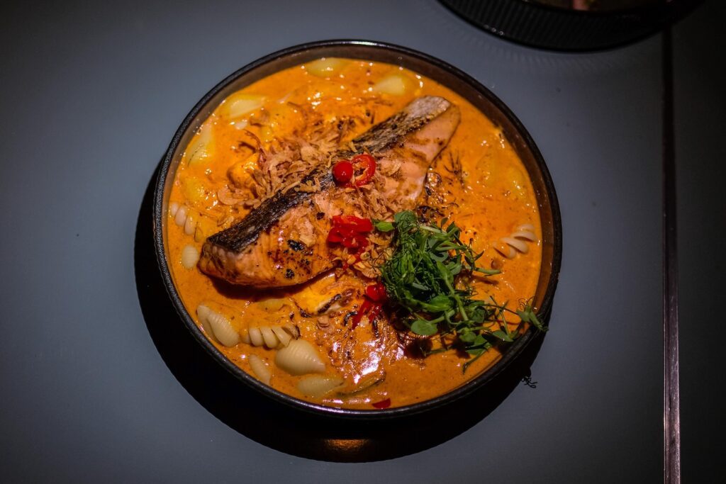 Panang curry mac & cheese with seared salmon, $26.95, from They Say That in Bushwick, Brooklyn