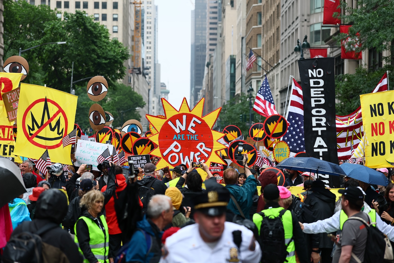 People march in the "No Kings" protest along Fifth Avenue on June 14, 2025 in New York, New York. Hundreds of marches and protests as part of a "national day of peaceful protest" against the Trump administration are happening across the United States today in opposition to his presidency and his policies. The national protest comes as President Donald Trump's military parade celebrating the 250th anniversary of the U.S. Army is taking place in Washington, DC. Today's parade coincides with President Trump's birthday.