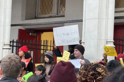 Protestor at Mayor Mamdani's "Rental Ripoff" hearing in Downtown Brooklyn