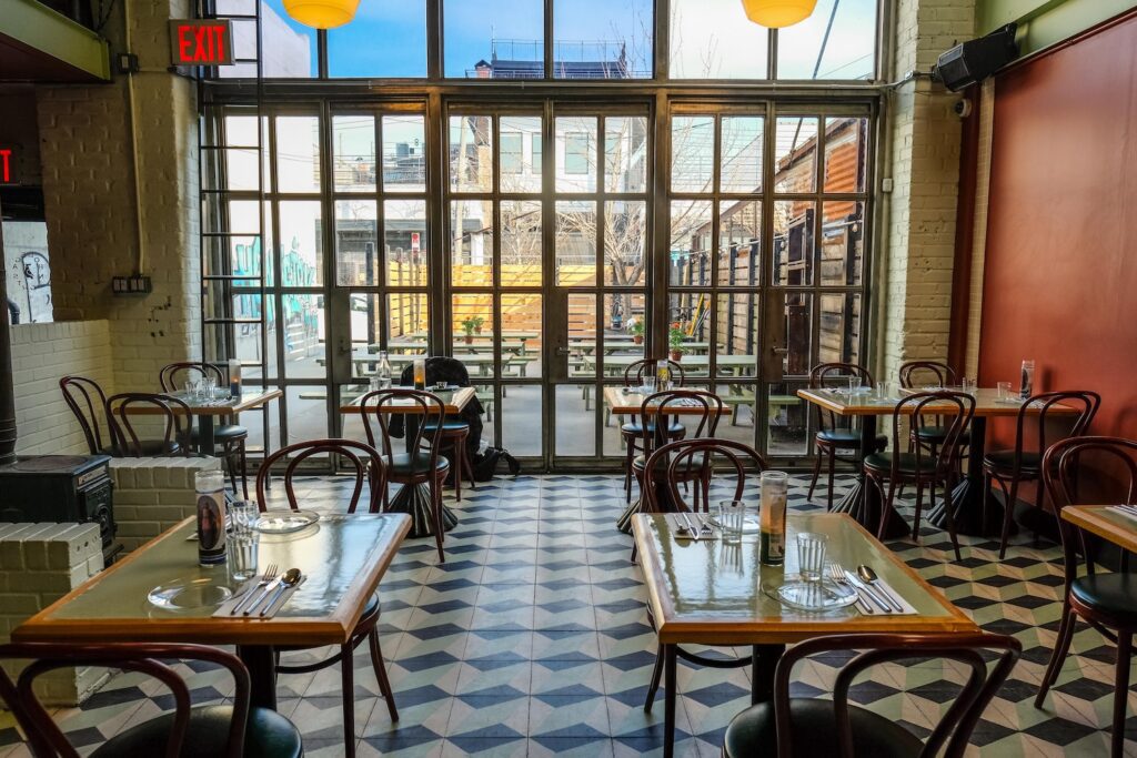 Dining area at Bodega Nights in Bushwick