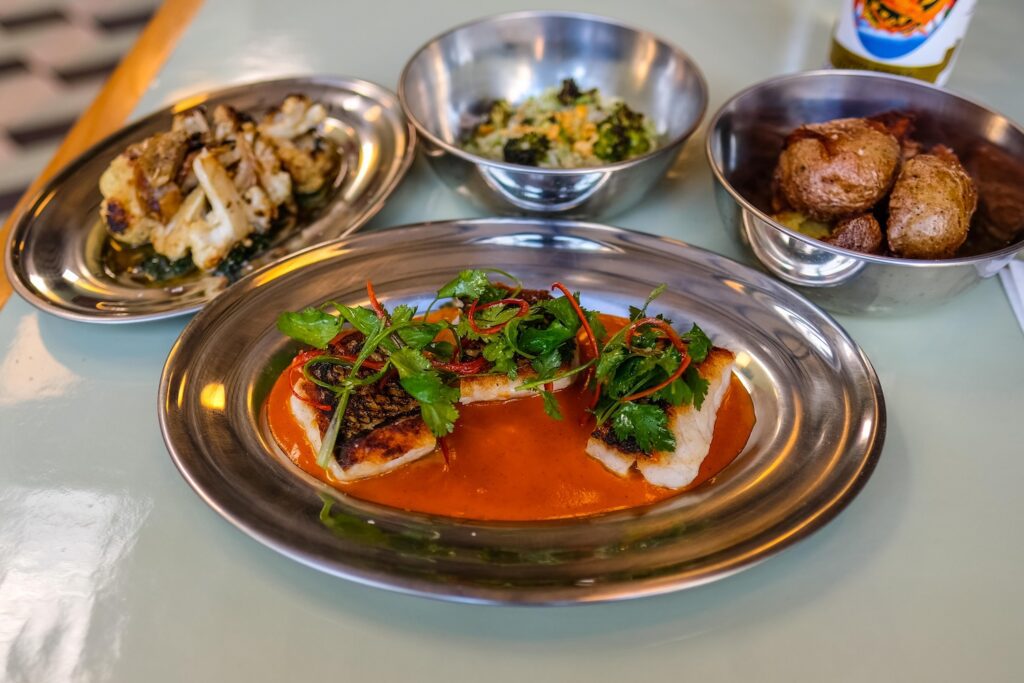 Fish a la plancha with three sides, $34, at Bodega Nights in Bushwick