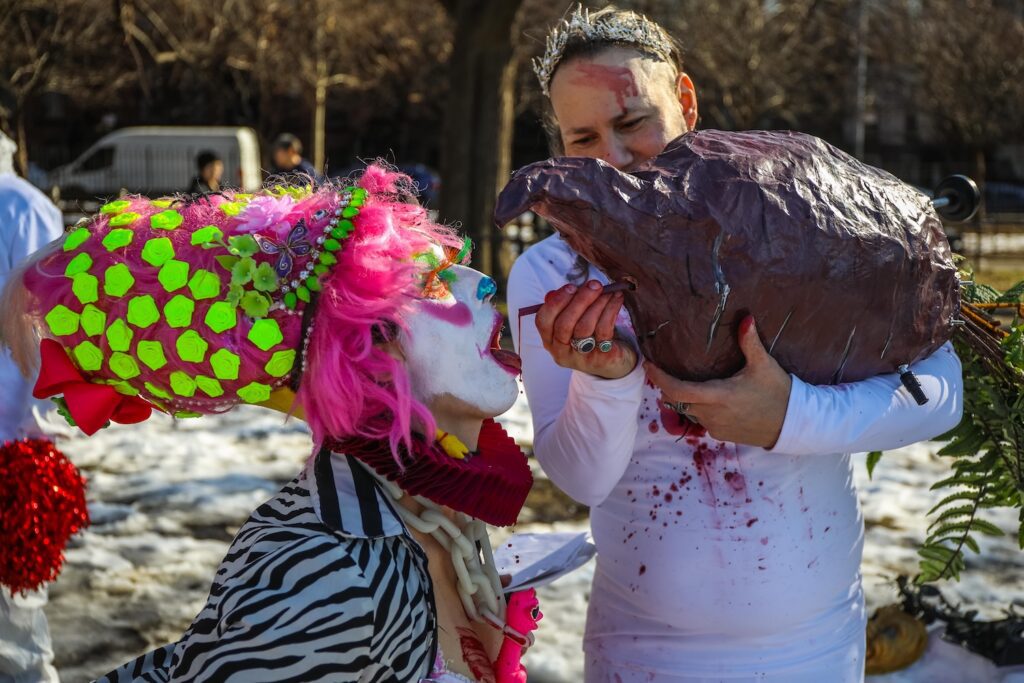 A judge gets bribed with "beet juice" at the eighth annual Competitive Winter Picnicking Games in Bed-Stuy, Brooklyn
