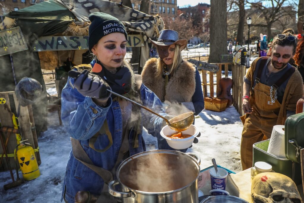 Annie Vilani serves up the Ghoulish Ghoulash at the eighth annual Competitive Winter Picnicking Games in Bed-Stuy, Brooklyn