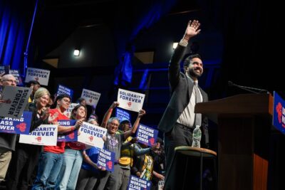 New York City Mayor Zohran Mamdani waves to supporters during a pro-union rally organized by US Senator Bernie Sanders, on April 12, 2026 in New York City. The rally comes two days after Zohran Mamdani’s 100th day as the Mayor of New York City.