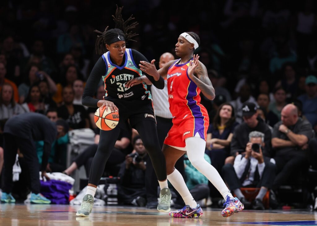 Jonquel Jones #35 of the New York Liberty dribbles the ball against Natasha Mack #4 of the Phoenix Mercury during the third quarter at Barclays Center on May 27, 2026