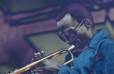 American trumpeter and composer Miles Davis (1926 - 1991) performing live on stage at the Newport Jazz Festival at Newport, Rhode Island, 5th July 1969.
