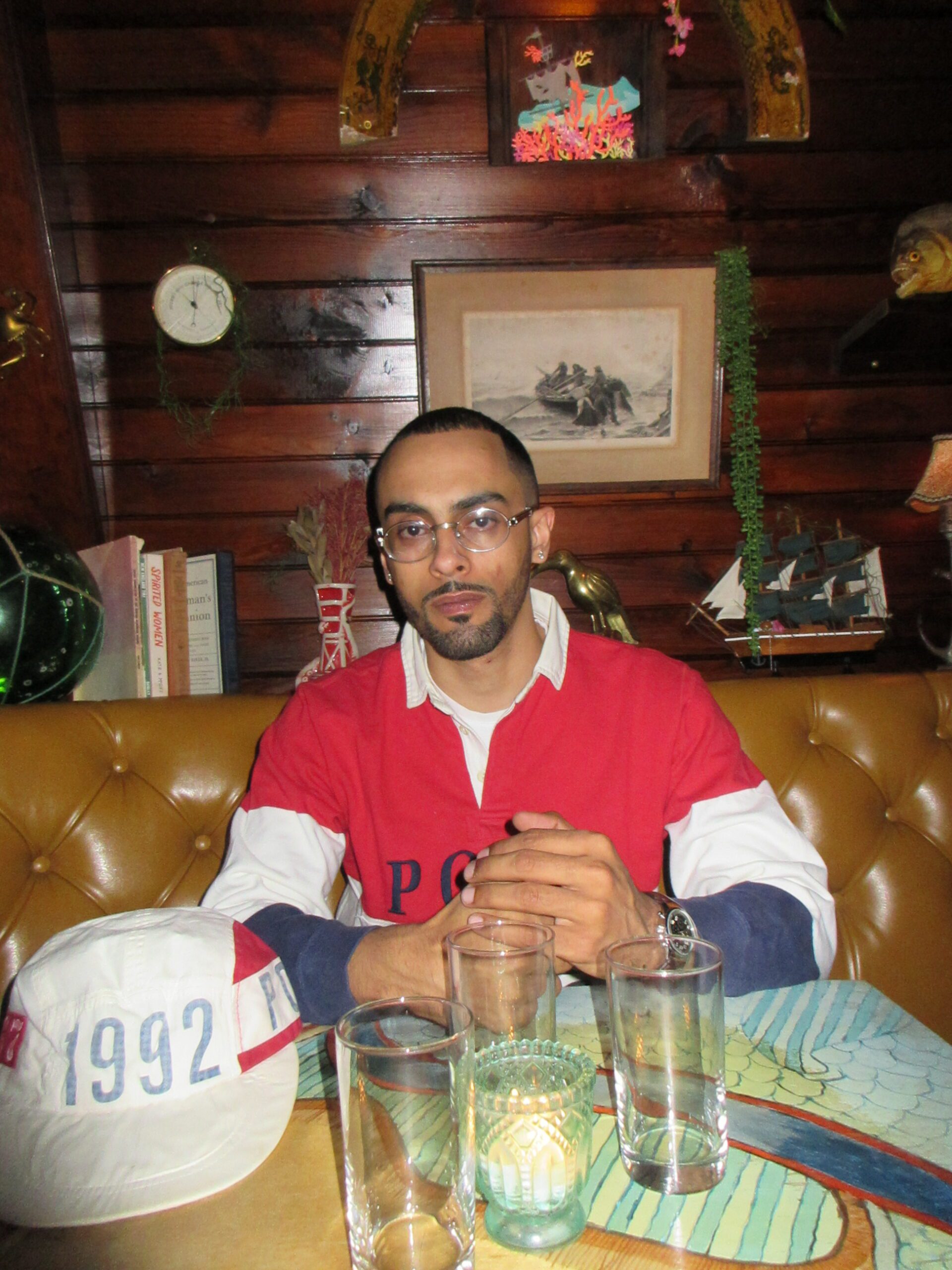 Brooklyn rapper Starker sitting in the tiki bar above a steakhouse in Downtown Brooklyn
