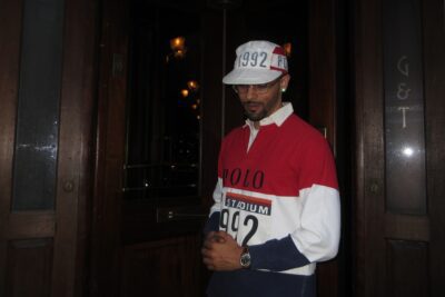 Brooklyn rapper Starker standing in front of Gage & Tolner in Downtown Brooklyn.