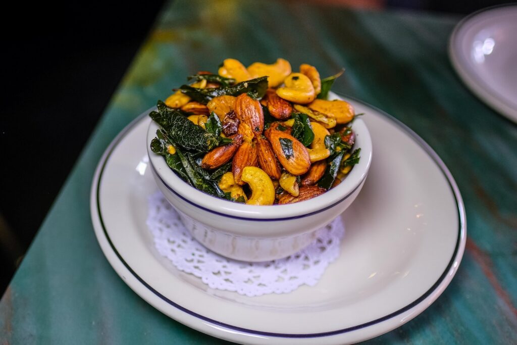 Marsala nuts with fried curry leaves, $8, from Tavern Next Door in Red Hook, Brooklyn